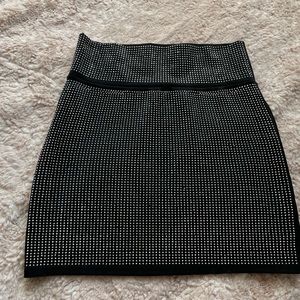 Fashion nova mini skirt. Black with mini studs. Fancy. Good quality. Size L.